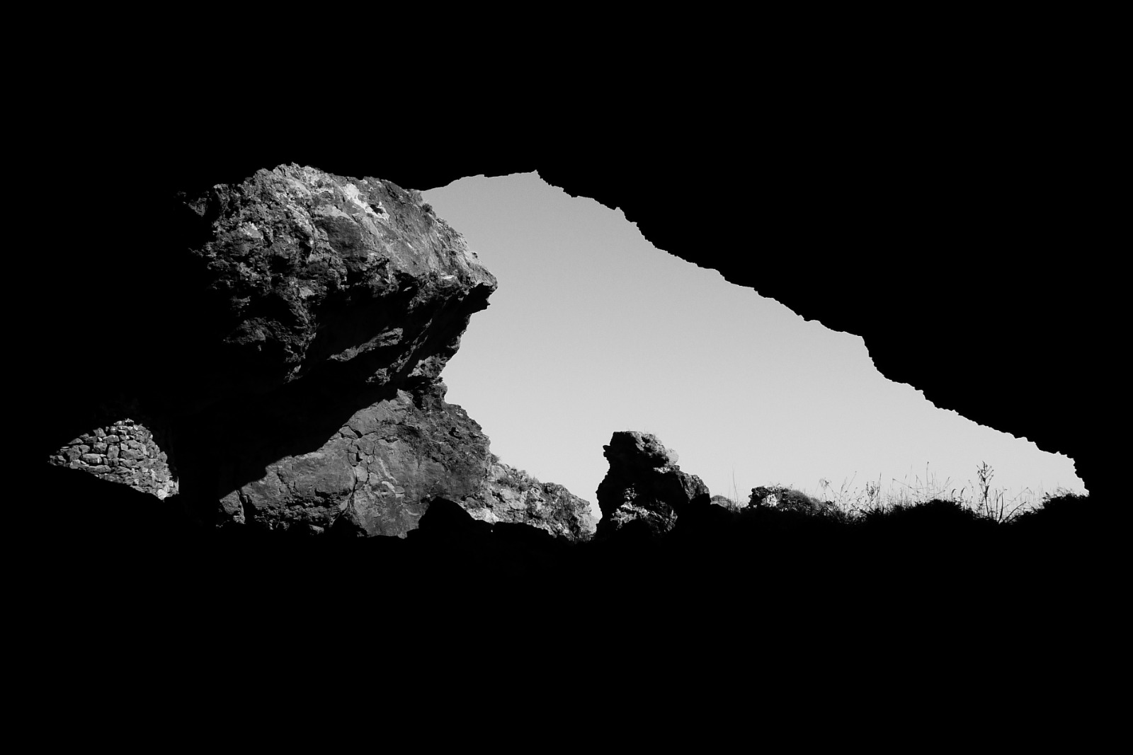 A mine opening in Serifos, silhouetted against the sky
