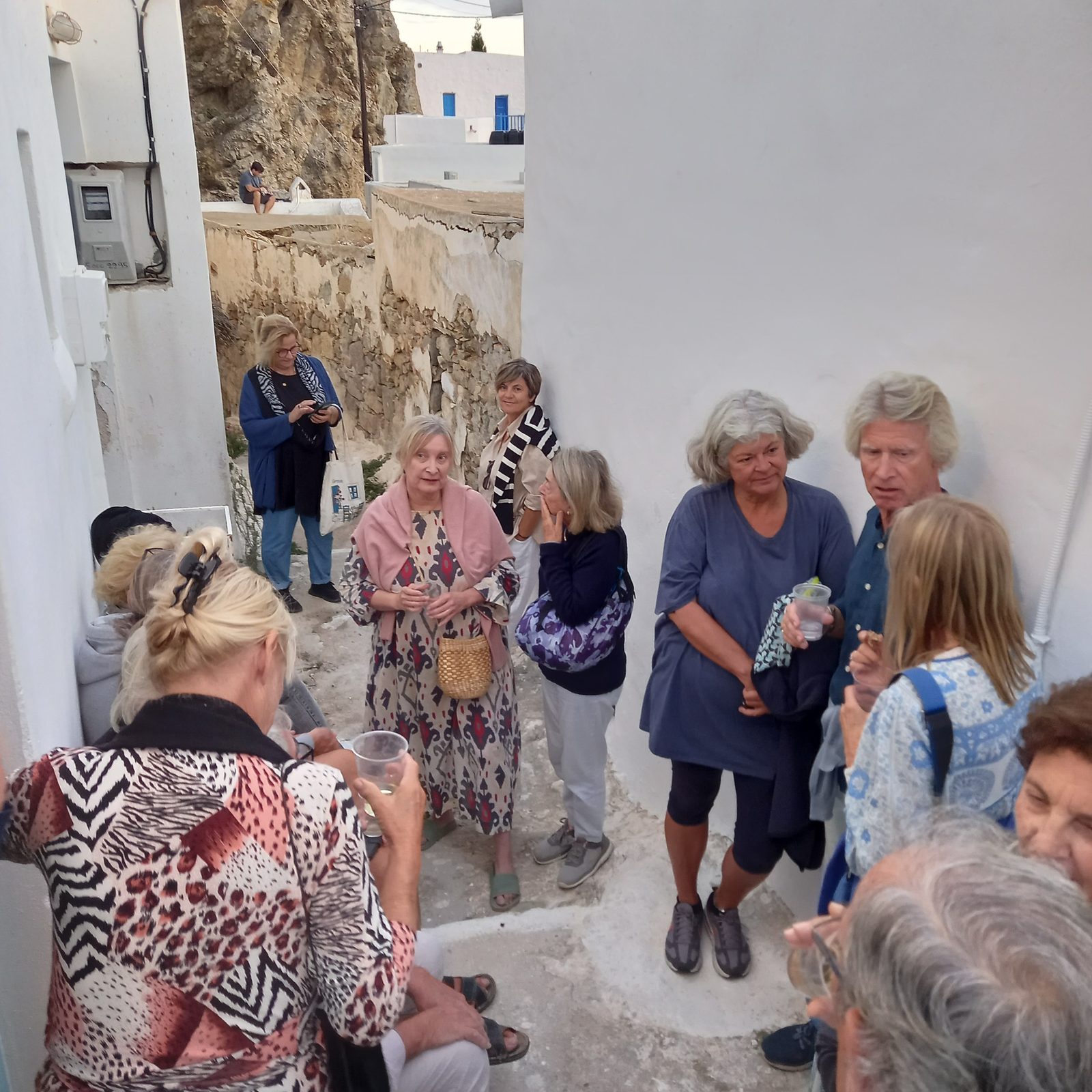 Guests spilling out into the whitewashed lane outside Kotoki in Ano Chora